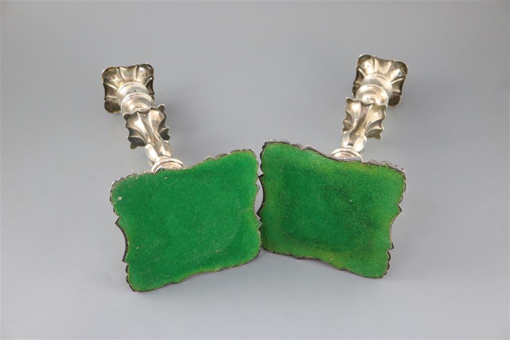 A pair of Edwardian silver candlesticks by William Hutton & Sons,